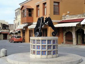The fountain with three seahorses in the Jewish Quarter - Walking Tour of Rhodes Town